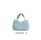 Borsa a mano con perle decorative e tracolla regolabile Celeste